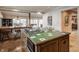 Kitchen with large island, green tile cooktop, and bar seating at 3585 Bay Rd N Dr, Indianapolis, IN 46240
