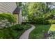 Charming walkway through lush landscaping leading to the lake at 3585 Bay Rd N Dr, Indianapolis, IN 46240