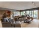 Inviting living room with large windows offering scenic lake views and comfortable seating at 3585 Bay Rd N Dr, Indianapolis, IN 46240