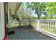 Charming back porch featuring outdoor furniture and leafy tree views at 3668 Chatsbee Ct, Indianapolis, IN 46224