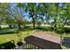 Back porch featuring outdoor furniture and lush, green backyard views at 3668 Chatsbee Ct, Indianapolis, IN 46224
