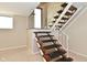 Basement with wooden stairs and white railing at 3668 Chatsbee Ct, Indianapolis, IN 46224