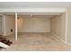 Spacious basement featuring a support beam, carpeted floor, and ample room for customization at 3668 Chatsbee Ct, Indianapolis, IN 46224