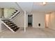 Spacious basement with stairs and neutral walls ready for customization at 3668 Chatsbee Ct, Indianapolis, IN 46224