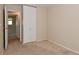 Bedroom with closet and doorway, featuring neutral carpet and walls at 3668 Chatsbee Ct, Indianapolis, IN 46224