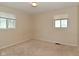Neutral primary bedroom features two windows for optimal natural light at 3668 Chatsbee Ct, Indianapolis, IN 46224