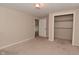 A light-filled bedroom boasts a closet and neutral carpet at 3668 Chatsbee Ct, Indianapolis, IN 46224