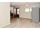 Dining room with tile floors, kitchen access and bright window at 3668 Chatsbee Ct, Indianapolis, IN 46224