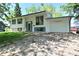 Charming home with light colored siding, updated windows, attached garage, and driveway at 3668 Chatsbee Ct, Indianapolis, IN 46224