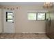 Bright eat in area with large window, stainless steel refrigerator, and access to the back yard at 3668 Chatsbee Ct, Indianapolis, IN 46224