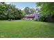 Spacious backyard with a fire pit and ample lawn space, providing a serene and private outdoor setting at 3713 W 98Th St, Carmel, IN 46032