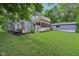 This backyard features a deck, screened porch and patio area at 3713 W 98Th St, Carmel, IN 46032