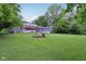 Expansive backyard features a fire pit, screened in porch, and two-story deck perfect for outdoor enjoyment at 3713 W 98Th St, Carmel, IN 46032