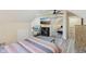 Comfortable bedroom with a TV, mirrored closet, and an accent chair for relaxation and enjoyment at 3713 W 98Th St, Carmel, IN 46032