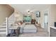 Comfortable living room with a large sectional, wood floors, and a cozy ambiance near staircase at 3713 W 98Th St, Carmel, IN 46032