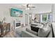 Comfortable living room with a large sectional sofa, modern fireplace, and a large TV at 3713 W 98Th St, Carmel, IN 46032