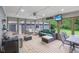 Relaxing sunroom featuring wicker furniture and a ceiling fan, perfect for enjoying natural light and outdoor views at 3713 W 98Th St, Carmel, IN 46032