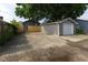 Backyard area with driveway, garage, fenced yard, and easy access to the home at 3822 Spann Ave, Indianapolis, IN 46203