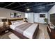 Finished basement bedroom featuring neutral tones, ample natural light, and stylish decor at 3822 Spann Ave, Indianapolis, IN 46203