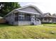 Charming bungalow with stone accents, a cozy front porch, and well-maintained lawn at 3822 Spann Ave, Indianapolis, IN 46203