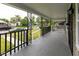Relaxing front porch with decorative wrought iron and a view of the neighborhood street at 3822 Spann Ave, Indianapolis, IN 46203