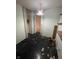 Empty bedroom with black floors, light green walls, and an open closet at 3908 Bertrand Rd, Indianapolis, IN 46222