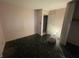A corner bedroom with a closet and a black, speckled floor at 3908 Bertrand Rd, Indianapolis, IN 46222