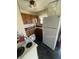 Close up of kitchen area featuring white appliances, wood cabinets, and fan at 3908 Bertrand Rd, Indianapolis, IN 46222