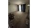 Spacious, empty living room area featuring black curtains and carpet at 3908 Bertrand Rd, Indianapolis, IN 46222
