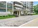 Image of the exterior of the Tarkington Tower building with stone-paved entry and manicured landscaping at 4000 N Meridian St # Apt 11D, Indianapolis, IN 46208