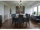 Spacious dining room features modern lighting, hardwood floors, and large windows at 4000 N Meridian St # Apt 11D, Indianapolis, IN 46208