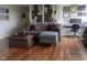 Cozy living room with a comfortable sofa, ottoman, and a built-in desk for work at 4000 N Meridian St # Apt 11D, Indianapolis, IN 46208