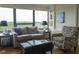 Bright living room features a comfortable sofa, patterned chair, and a large window at 4000 N Meridian St # Apt 11D, Indianapolis, IN 46208