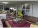 Elegant living area boasts mirrored walls, unique decor, and hardwood flooring at 4000 N Meridian St # Apt 11D, Indianapolis, IN 46208