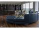 Stylish living area featuring custom built-ins, modern seating, and a wall of windows for abundant light at 4000 N Meridian St # Apt 11D, Indianapolis, IN 46208