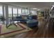 Open-concept living area with a bar, modern furnishings, and hardwood floors at 4000 N Meridian St # Apt 11D, Indianapolis, IN 46208