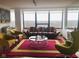 Bright living room featuring large windows, unique furniture, and a modern aesthetic at 4000 N Meridian St # Apt 11D, Indianapolis, IN 46208