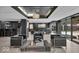 Stylish lounge with black leather seating, modern lighting, and glass doors to the exterior at 4000 N Meridian St # Apt 11D, Indianapolis, IN 46208