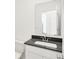 Bathroom features a black countertop, chrome faucet, and undermount sink at 4390 Red Pine Dr, Bargersville, IN 46106