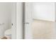 Bathroom with a partial view of the toilet and bright natural light coming from an adjacent bedroom at 4390 Red Pine Dr, Bargersville, IN 46106