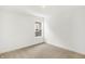 Bedroom with a window featuring neutral carpeting and white walls, providing a simple canvas at 4390 Red Pine Dr, Bargersville, IN 46106
