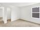 Bright bedroom with plush carpet, a walk-in closet, and a window for natural light at 4390 Red Pine Dr, Bargersville, IN 46106