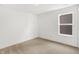 Bright bedroom features neutral carpet, white walls, and a window for natural light at 4390 Red Pine Dr, Bargersville, IN 46106