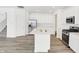 Gourmet kitchen with stainless steel appliances, white cabinetry, and island with seating at 4390 Red Pine Dr, Bargersville, IN 46106