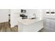 Stylish kitchen with an island, modern appliances, and wood-look flooring at 4390 Red Pine Dr, Bargersville, IN 46106