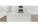 Modern kitchen island with sink and stainless steel appliances at 4390 Red Pine Dr, Bargersville, IN 46106