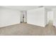 Open living space with carpet and access to other rooms at 4390 Red Pine Dr, Bargersville, IN 46106