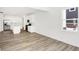 Open-concept living room with hardwood floors, a modern kitchen, and plenty of natural light at 4390 Red Pine Dr, Bargersville, IN 46106