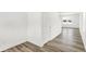 Open-concept living area with sleek, modern flooring and staircase to the upper level at 4390 Red Pine Dr, Bargersville, IN 46106