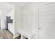Mudroom with coat rack, bench, and garage access at 4390 Red Pine Dr, Bargersville, IN 46106